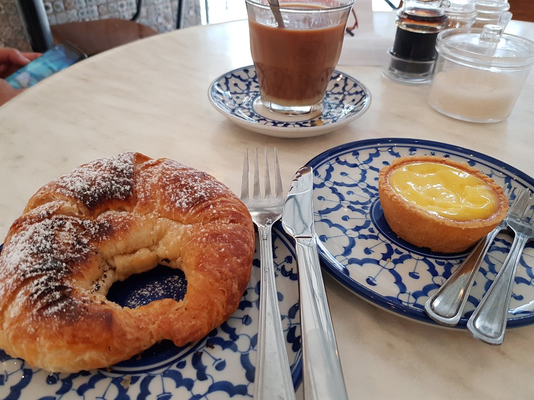 Nak Hotel Egg Tarts While waiting at airport luggage belt, we saw a poster of nice looking egg tarts and decided to seek out this cafe once...